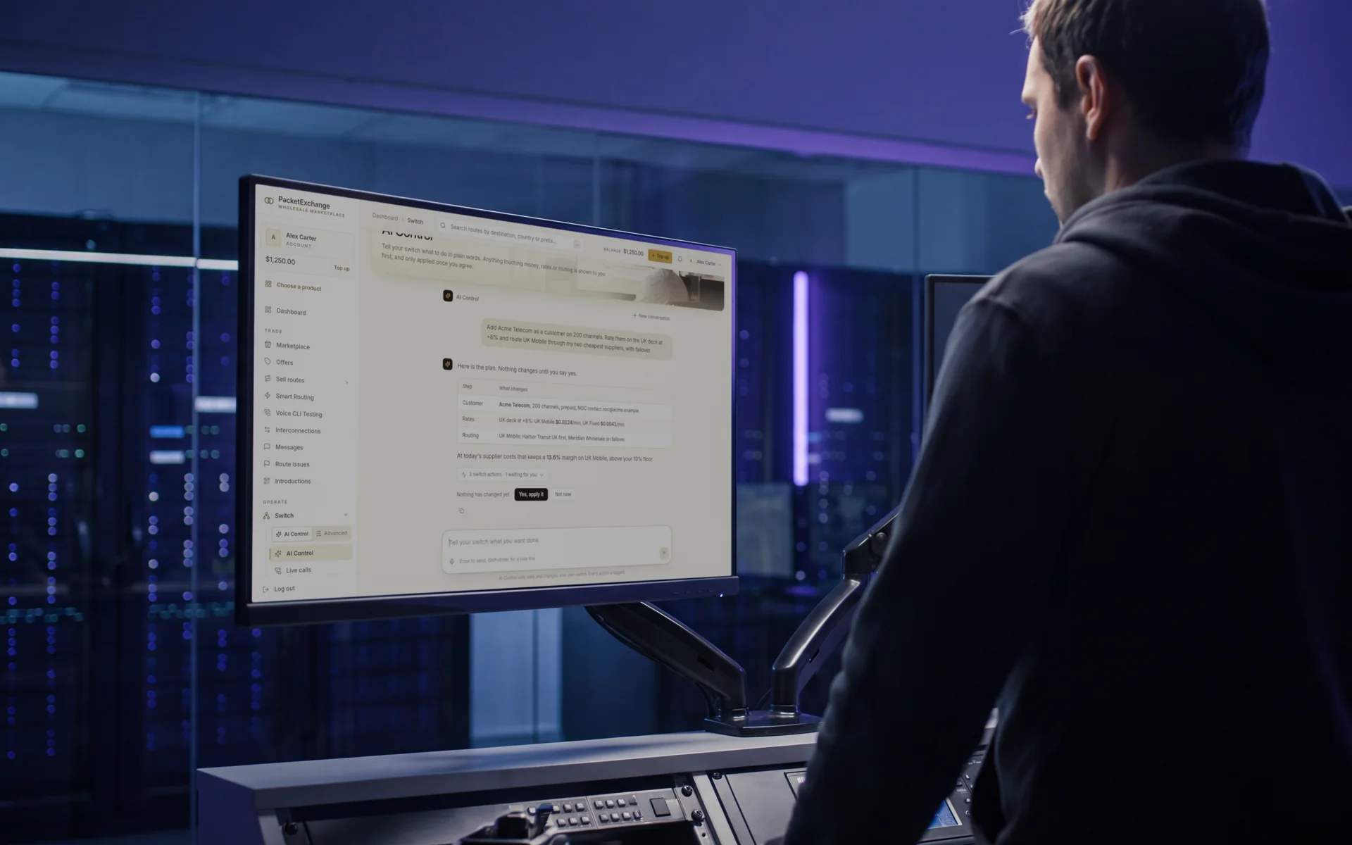 An operator standing at a monitor where AI Control lays out a plan to add a customer on 200 channels, rate them and route with failover, waiting for approval