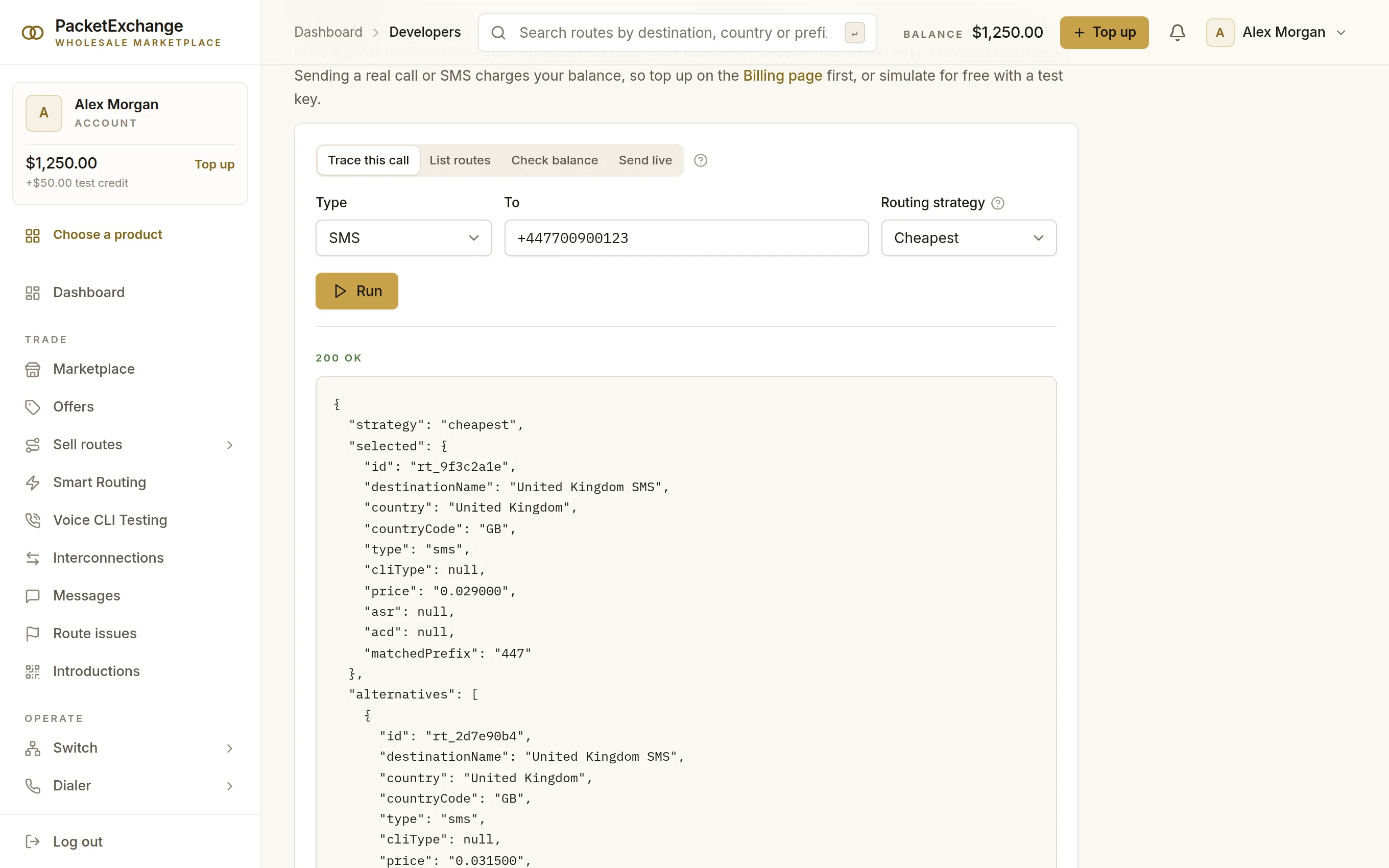 Developer console tracing an SMS to a UK mobile with the cheapest strategy: a 200 OK response naming the selected route, its price per message and an alternative